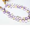 Natural Ametrine Smooth Pear Drop Briolette Beads Strand Sold per 8 inches strand and Size 10mm to 11mm approx. Ametrine, also known as trystine or by its trade name as bolivianite, is a naturally occurring variety of quartz. It is a mixture of amethyst and citrine with zones of purple and yellow or orange 